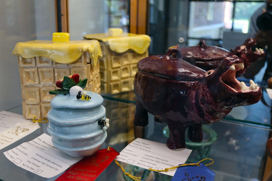 Pottery works on exhibit at the Crestview Public Library include Kimberly Zarate-Altamirano’s “Memory Stone” and Brayden Willoughby’s blue-ribbon-winning “Hippo.”
