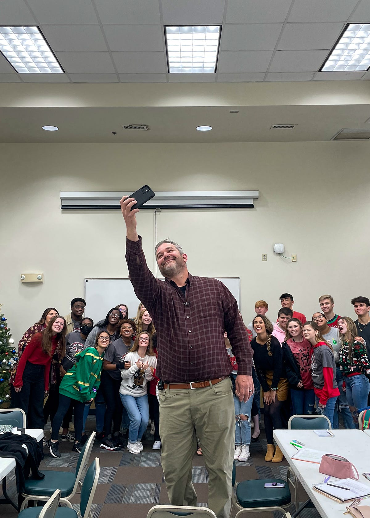 Crestview City Manager Tim Bolduc takes a selfie with Crestview High School SGA members during a presentation Dec. 9.