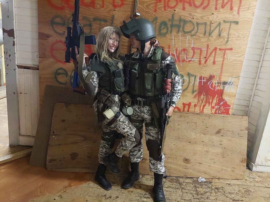Chernobyl MilSim founder and event producer Dako Morfey embraces his girlfriend and fellow live-action role player, Dottie Dellamorte, during the organization’s April event in Holt. The third and final chapter of The Meadow is June 25-27.