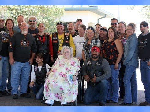 Riders pose with Lois Eileen Ellis, a Shoal rehabilitation patient.