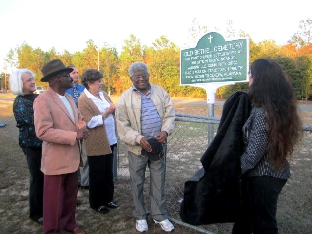 Crestview Historic Preservation Board members admire the board's second historical marker as it is unveiled Wednesday at Old Bethel Cemetery. From left are Linda Parker, Clyde Hayes, Joe Faulk, Pat Hollarn, James Conyers and board chairwoman Ann Spann.