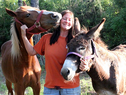 Baker resident Alison Broxson — with her horse, Rocky, and donkey, Curley — says losing her beloved wirehaired terrier, Piston, 10 years ago and seeing the number of lost North Okaloosa pets inspired her to create a Facebook page to facilitate reunions.