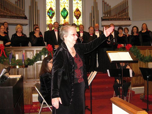 Marilyn Overturf, the Okaloosa Chamber Singers’ director, presents the ensemble at a previous Christmas concert in DeFuniak Springs.
