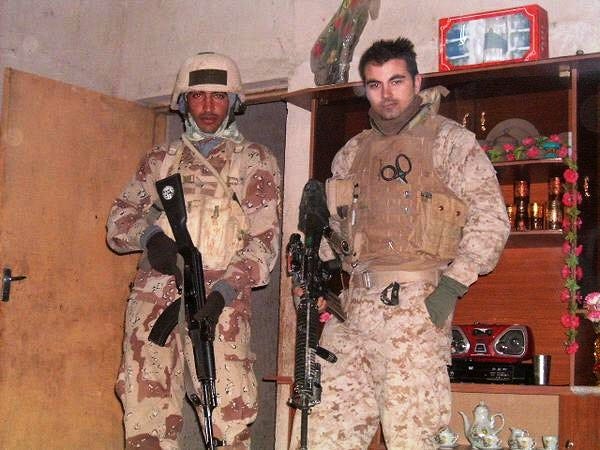 Crestview High School alumnus Victor Everett, right, is seen serving as a U.S. Navy corpsman in Iraq in the early 2000s.