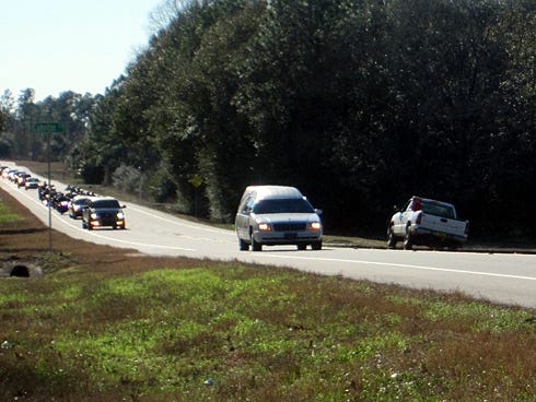 Southbound State Road 85 traffic pulls over this afternoon as Sgt. 1st Class William Lacey's funeral procession winds north to Laurel Hill.