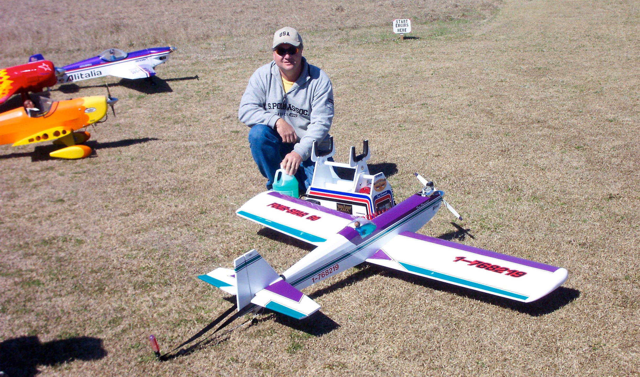 Tony Dunavant shows off his remote controlled airplane during a Laurel Hill RC Flyers gathering. The revived club's leaders have reached a land use agreement with city officials; they seek more members and plan to host community events.
