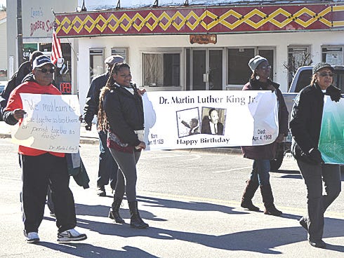 An estimated 30 residents commemorated Dr. Martin Luther King Jr.'s legacy on Saturday with a march in downtown Crestview.