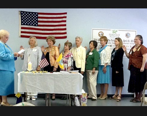 Sue Bratton, Florida state regent, swears in Daughters of American Colonists-Eucheeanna chapter officers recently at Heritage Museum in Valparaiso. From left are Bratton and Margaret Nichols, organizing regent; Mary Ellen Ahlstorm, vice regent; Virginia Poffenberger, 2nd vice regent; Rita Takeuchi, chaplain; Tanya Ditto, recording secretary; Susan VanderZeyde, treasurer; Scarlett Brock, registrar; and Dianna Lantz, historian.