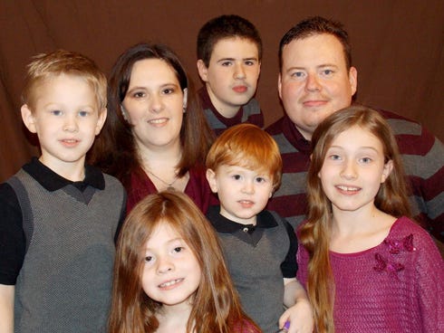 Gabriel Stackhouse, 7 — top row, far left — is back home with his family after a 12-day hospital stay. Pensacola doctors treated him for a severe case of viral meningitis that North Okaloosa Medical Center doctors diagnosed over the Fourth of July weekend. Pictured from left are Gabriel's mother, Michelle; brother, Jared; and his father, Kelly. On the bottom row are siblings Ellie, Zeke and Alena Stackhouse.