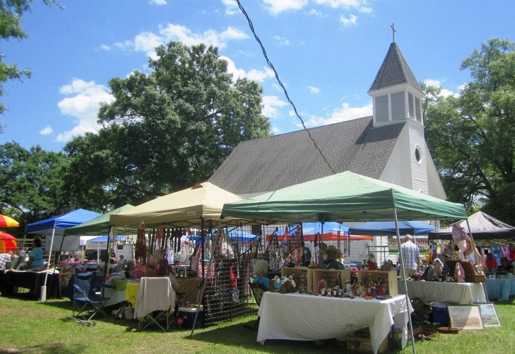 Artists, crafters, heritage displays and classic cars fill historic Laurel Hill Presbyterian Church's spacious side and rear yard during the town's 2015 Arts and Heritage Festival.