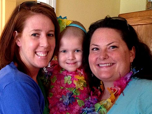Crestview resident Katie Mitchell, 3 — flanked by her mother, Jaime, left, and Gretl Stenske — is receiving chemotherapy treatments for leukemia. Stenske and her son, Zac, will shave their heads on Sunday at the Pensacola Bayfront Stadium to support Katie. The "Praying for Carolyn" event — which raises awareness for Carolyn Hendrix, a 5-year-old Pensacola resident with Ewing's sarcoma, a rare bone cancer — will benefit the St. Baldrick’s Foundation, which helps fund childhood cancer research.