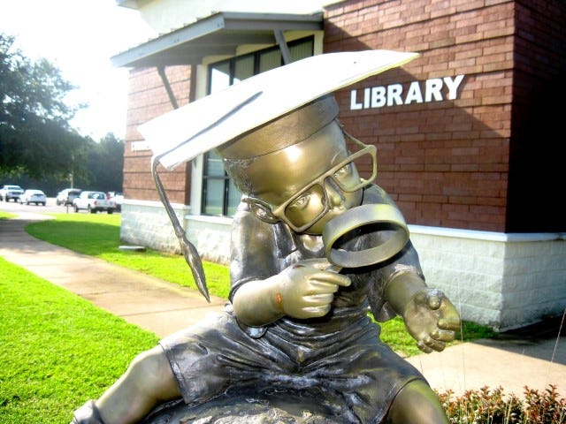 Vandals ripped the book from the hands of “The Whiz Kid,” a bronze sculpture outside the Crestview Public Library. Library staffers seek a welder or art restorer to put the book back in place. Call 682-4432 if you can help.