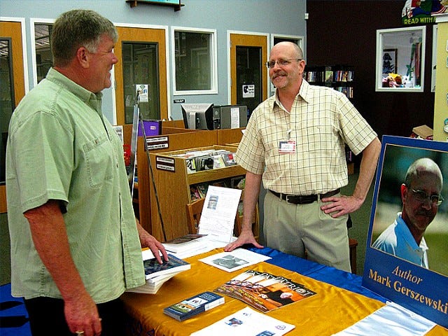 Resident Craig Yort meets Mark Gerszewski at Monday’s book signing at the Crestview Public Library. Yort said he looks forward to attending tomorrow’s fundraiser benefiting Fisher House of the Emerald Coast, at which participants will receive a free autographed copy of Gerszewski’s “Homo Sapiens: A Species Gone Ape.”