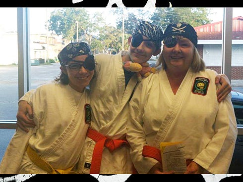 The LaRoche family — Caitlyn, Caleb and Janet — arrive in pirate attire on International Talk Like a Pirate Day at Gordon "Marrrtial Arrrts."