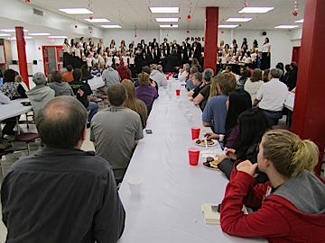 Attendees enjoy pancakes, sausage, orange juice, coffee and a performance by Chorale during the Crestview High chorus' 2011 pancake breakfast.