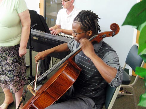 Cellist Montavius Diamond performs his first Music at the Library concert Tuesday evening.