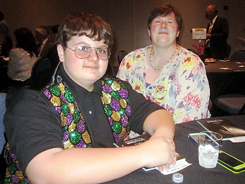Antioch Elementary School fifth-grader Lucas Kornegay and his mother, Angela, relax following his recent cello performance with the Sinfonietta Strings.