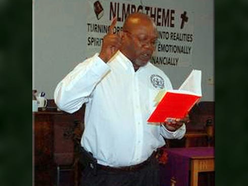 Dale Landry, vice president of the NAACP's Florida Conference, reads from Dr. Martin Luther King Jr.'s "Letter from the Birmingham Jail" on Saturday during a meeting at the Missionary Baptist Church in Crestview.