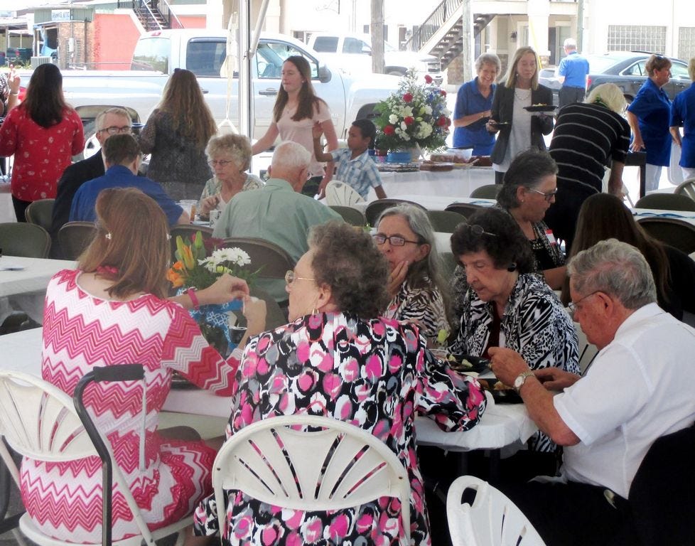 Former and current members, guests and friends of the First Presbyterian Church of Crestview celebrate the downtown church's centennial with a dinner-on-the-grounds after Sunday worship.