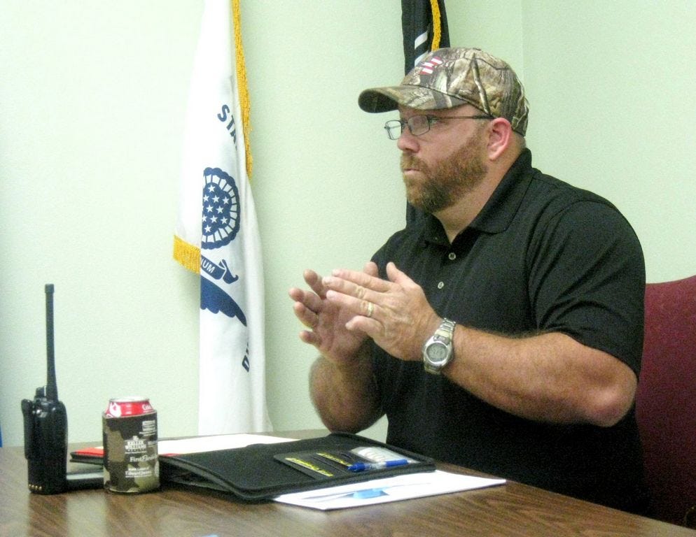 Laurel Hill City Councilman Travis Dewrell presents arguments at Thursday evening's council meeting against repairing a 24-year-old generator that had been hit by lightning.