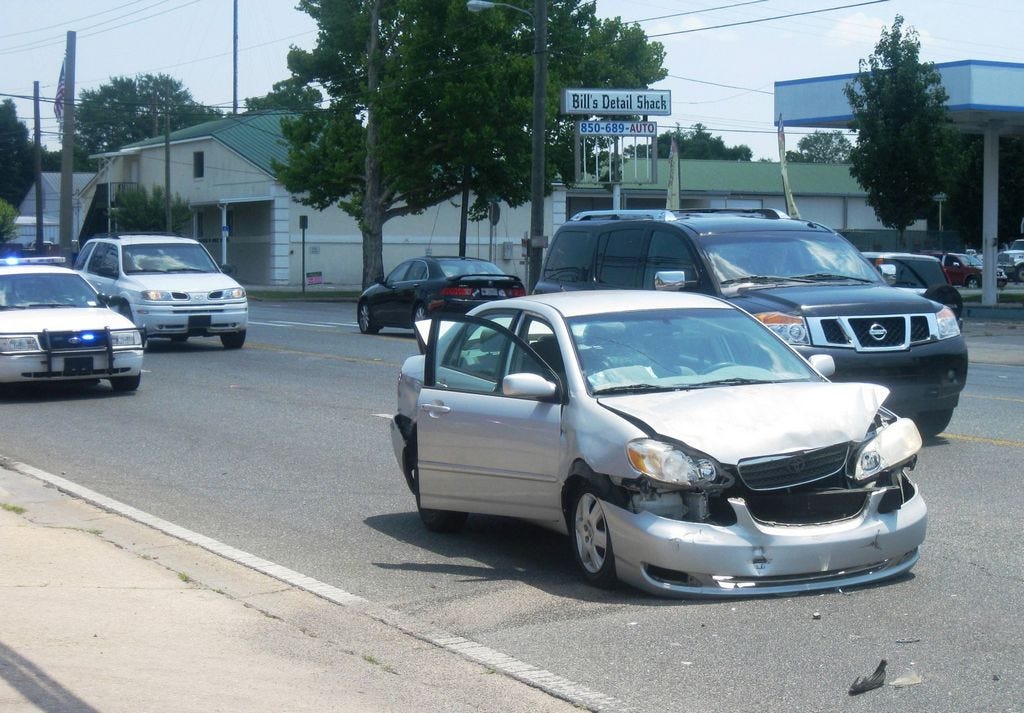 This silver Toyota sedan was in the middle of a three-vehicle wreck on State Road 85 North near the FLA GAS station and Exodos Ministries' thrift store Friday morning.