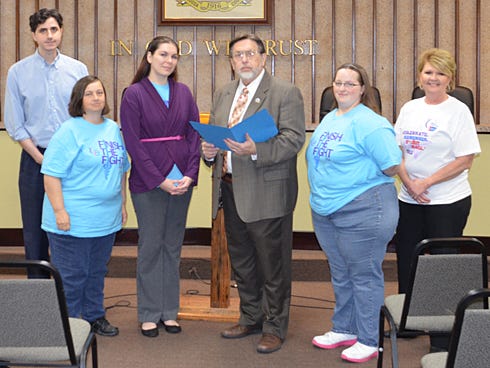 Pictured for the proclamation signing, center, are Relay For Life Event Chair Megan Bowersox and Cadle. Surrounding them, from left, are Thomas Boni, publicity chair; Sonia McCallum, survivor/caregiver chair; Sarah Douglass, Logistics Committee member; and Melanie Fullerton, luminaria chair.