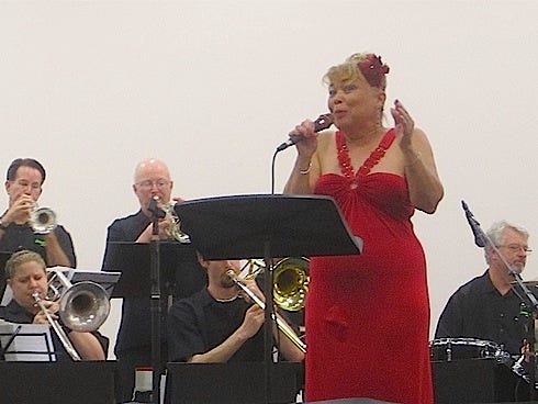 Saundra Daggs, “the first lady of Crestview jazz,” croons Cole Porter's “Night and Day” as the DownBeat Jazz Orchestra’s guest vocalist.
