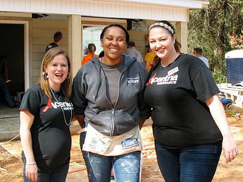 Student volunteers from Thomas More College in Crestview Hills, Ky., install shingles on a Crestview Habitat for Humanity house during their spring break.

Habitat2
Sommer Castille and Theresa Carroll, of the Crestview Acentria Insurance agency, meet Habitat homeowner La’Terica Clark while serving lunch to construction volunteers.