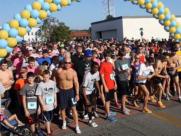 More than 2,000 people took part in the 2012 Race for Lace, shown preparing on Main Street for the start of the race.