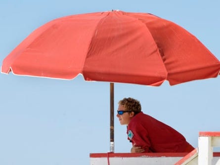 Okaloosa County lifeguard Michael Whitehurst keeps an eye on swimmers recently behind The Boardwalk on Okaloosa Island.