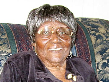 Longtime community leader Velma Conyers relaxes in her living room on her 100th birthday Thursday afternoon.