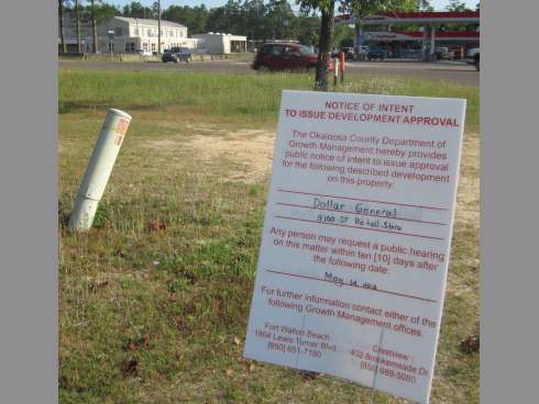 A Dollar General will stand on this lot across U.S. Highway 90 from the National Guard Armory, left, Valley Road and a gas station.