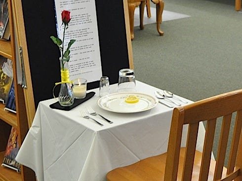 “America's White Table” appears at the Crestview Public Library for Veterans Day weekend. A popular book inspired the small display that honors U.S. soldiers.