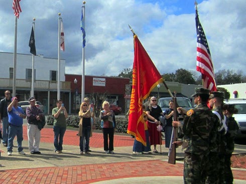 Residents and city officials recite the Pledge of Allegiance last year as the Emerald Coast Young Marines color guard presents the colors. "Stand Up and Say the Pledge" is at noon Monday in downtown Crestview.