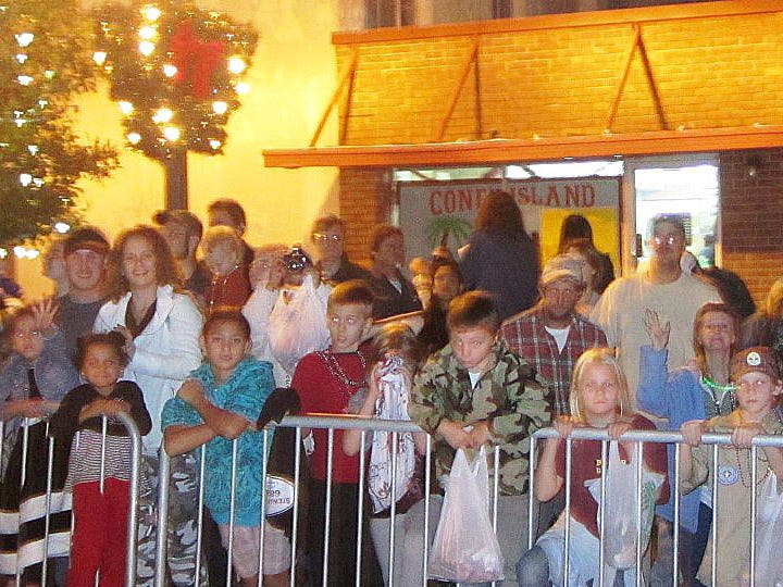 Crowds several people deep line Main Street in front of Coney Island during the 2011 Crestview Christmas Parade. Organizers say extending this year’s parade route will let people be less crowded.