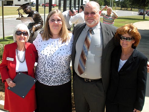 Flo Lembeck, the Friends of the Crestview Library's founding president, died Saturday after a brief hospitalization. Here she poses in front of the library's “The Whiz Kid” sculpture — along with her daughter-in-law, Fawn, son Larry Lembeck, and daughter Anne Weaver — during its September 2010 dedication.