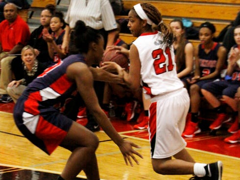 Crestview's Tiara Payne works her way around a Fort Walton Beach defender in the game between the Bulldogs and Vikings played on Jan. 12. Payne scored 16 points for Crestview in Tuesday's District 2-6A tournament loss to the Vikings.
