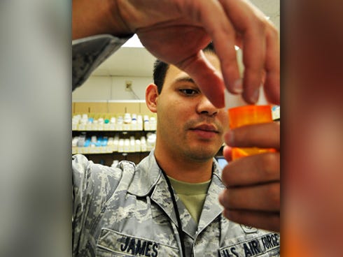 Air Force Senior Airman Nickolas J. James, of the 509th Medical Support Squadron, caps a medication at Whiteman Air Force Base, Mo. It's just one of his duties as a pharmacy technician.