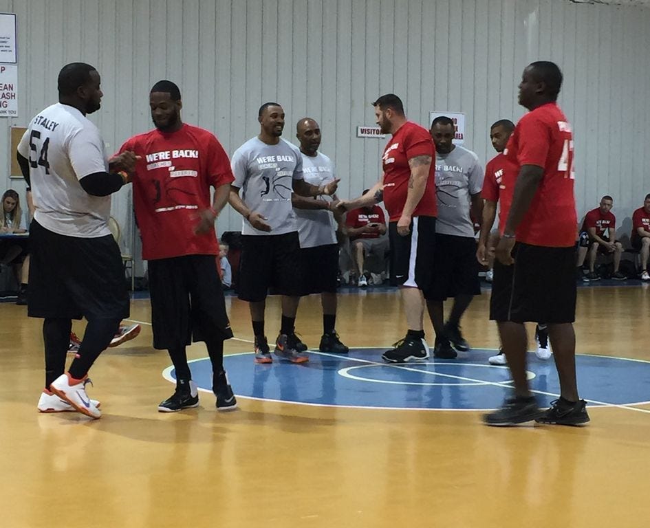 Referees and coaches get ready for a round of basketball Feb. 27 at the Twin Hills Park gym in Crestview. The referees won 104-68, but the coaches (red team) kept it close.