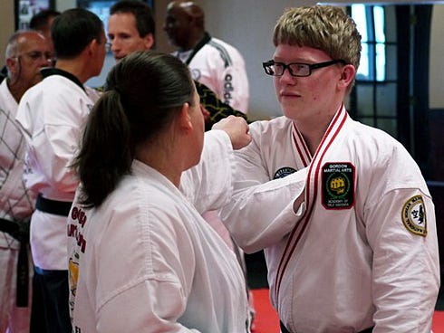 Richard Rounsaville, left, and his mother, Angela Mobley, practice martial arts techniques during last year's Korean Martial Arts Festival at Gordon Martial Arts in Crestview. The event returns to Crestview for the eighth year this weekend.