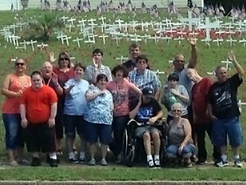 Crestview HEROES members worked for several weeks reconstructing and making poppy flowers for a Memorial Day display in front of American Legion Hall Post 75 at 898 James Lee Blvd E. Pictured at the display are, from left, Marcia Larkins, Corey Tobin, Gover Adkins, Devin Kersey, Renee Bingham, Kimberly Karpuk, Andrew Ausdenmoore, James Walton, Kathy Ellis, Beverley Daniel, Jerry Bolton, Bobby Richard, Sonya McArthur, Kathy Wise, John Lawrence and Kent Robinson.