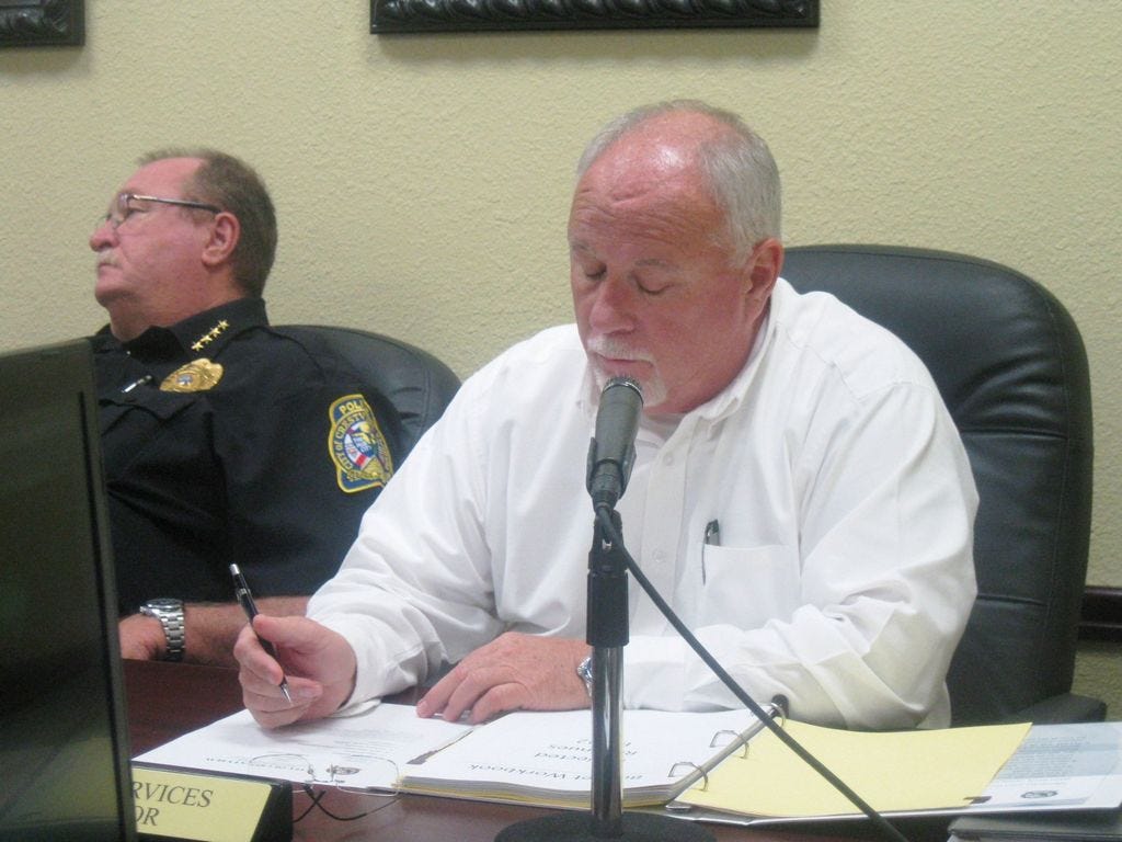 Public Works Director Wayne Steele reports on his budget expenditures so far in the 2015-16 fiscal year as Police Chief Tony Taylor listens.
