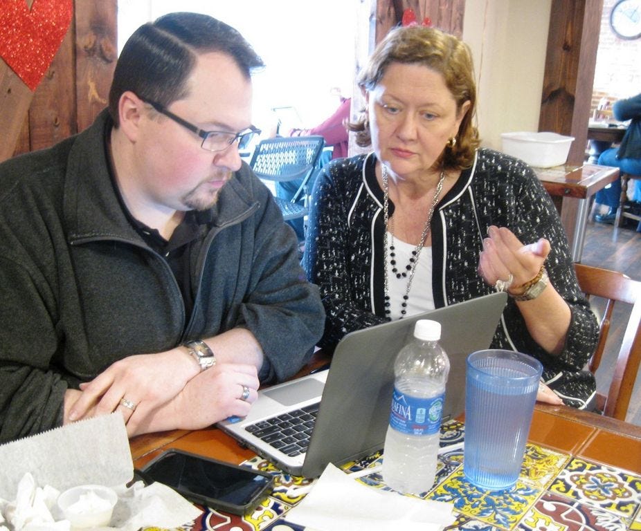 Crestview marketing consultant Jeremiah Hubbard discusses social media training plans for charitable organizations with Sharing Hands Network co-founder and CEO Esther Lynn Hemphill.