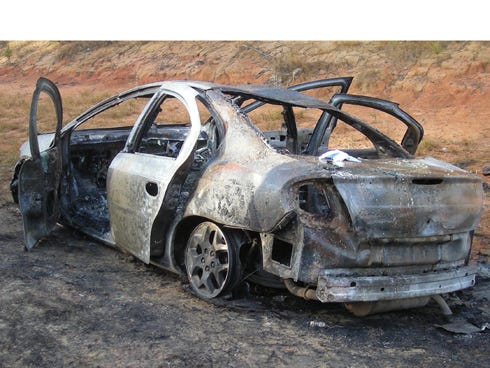 This 2000 Dodge Neon was totaled in a fire on U.S. Highway 393 near Laurel Hill on Tuesday. The unknown nature of the vehicle fire has led to an investigation from the Florida State Fire Marshal's Office. No one was injured in the fire.