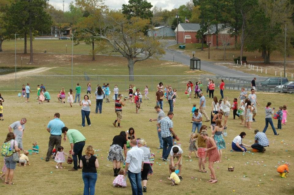 Parents and children collect Easter eggs on the recreational field at last year's Easter Sunday event at Twin Hills Park. Mosaic Church invites the community to this year's Easter event on April 20 at Twin Hills Park.
