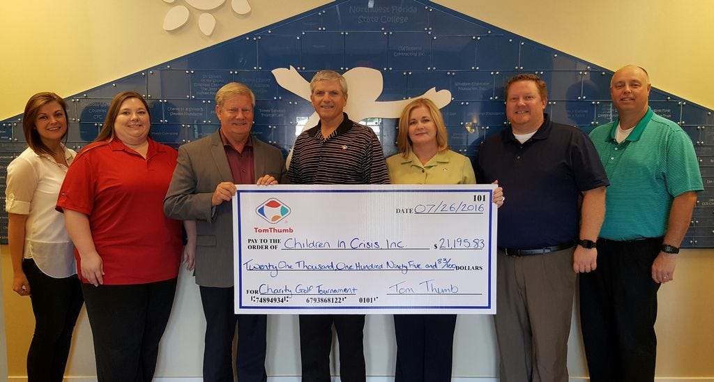 Tom Thumb KwikShops, headquartered in Crestview, donates $21,195.83 to Children in Crisis to help feed, clothe and care for at-risk children living at the CIC Neighborhood. Pictured from left are Aimee Brim; Kayla Denmon; Ken Hair, CIC president and CEO; Mark Salisbury, Tom Thumb Inc. president; Teresa Smith, Tom Thumb Inc. vice president of operations; Dan Spence; and David Parker Jr.