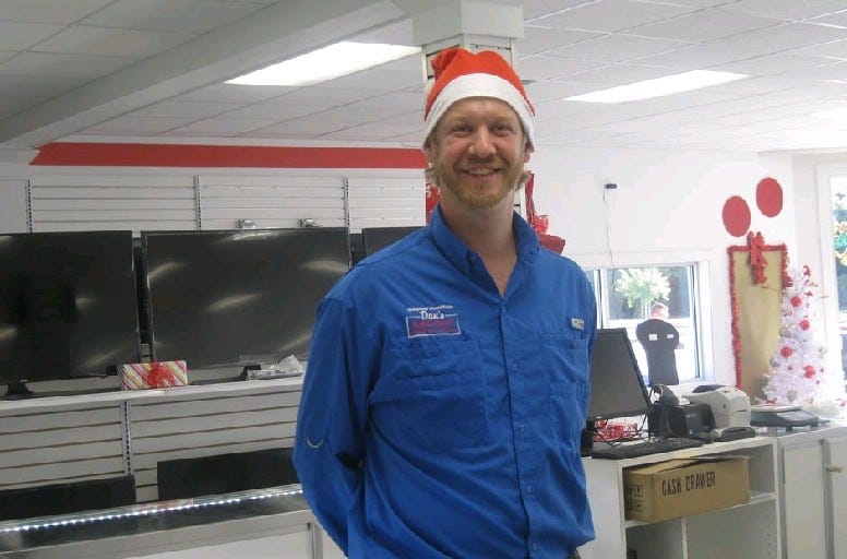 Dan's owner Bryce Jeter stands behind the main jewelry counter Dec. 1 in Crestview. Renee Bell | News Bulletin