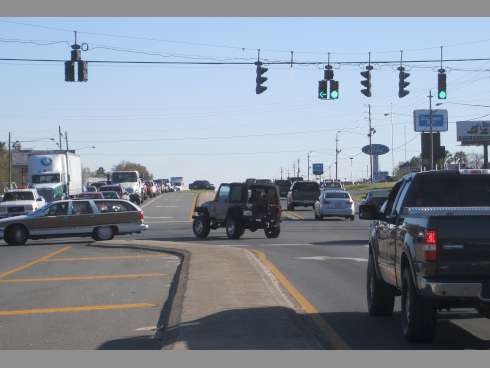 Motorists driving south on State Road 85 steer left on John King Road following a recently adjusted turn signal.