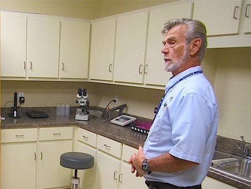 Master Gardener Bob Bayer surveys the new county extension building’s testing lab. In the old building, Bayer had to share lab space with phone volunteers and stored materials.
