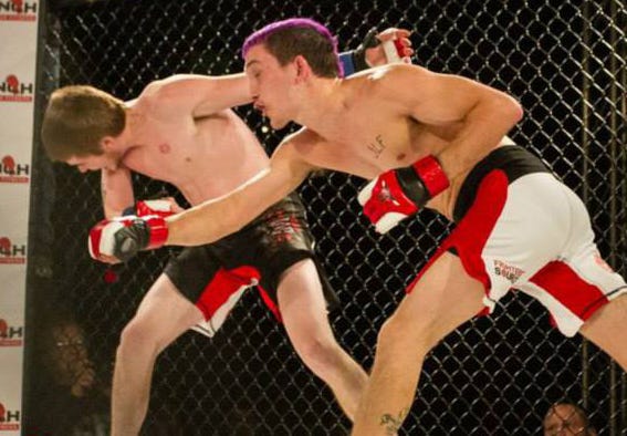 Representing the amateur mixed martial arts club, the Miami Punch, Crestview resident Chris Francis, right, lands a punch on Aaron Harvey of the Chicago Havoc at a Fighters Source competition in February. Francis, who is 11-0 when competing in the Fighters Source amateur MMA tournament, will travel to London next month to represent the U.S. in the Fighters Source Amateur MMA World Challenge.